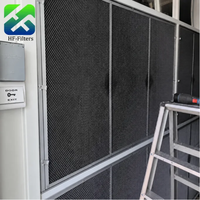 Black mesh pre-filters installed in a data center ventilation frame